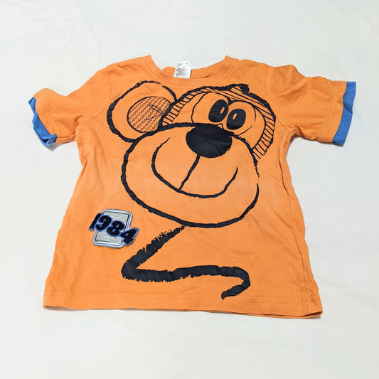 Orange shirt with monkey - size 4