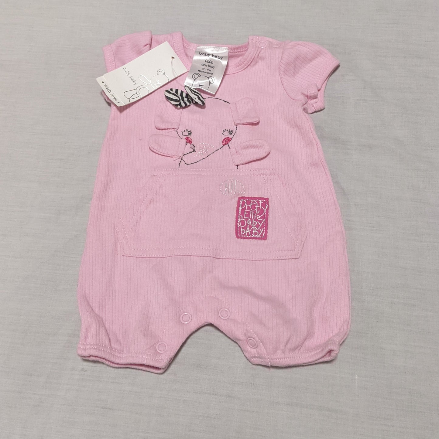 Pink ribbed romper with elephant - size 0000