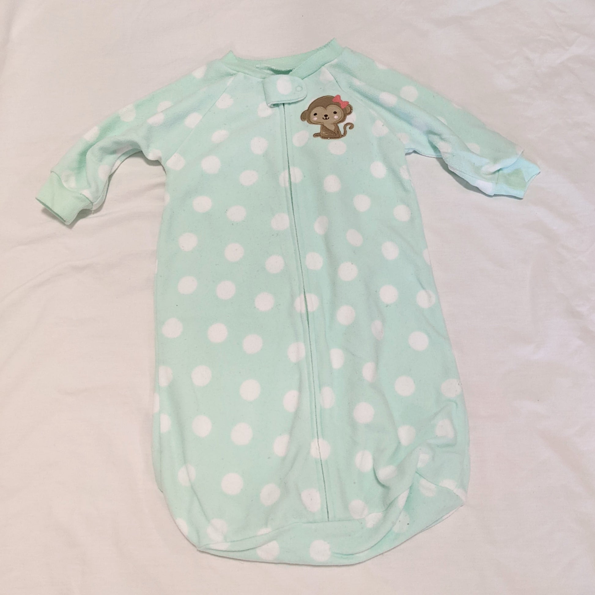 Teal spotty monkey fleece sleeping bag - size 00